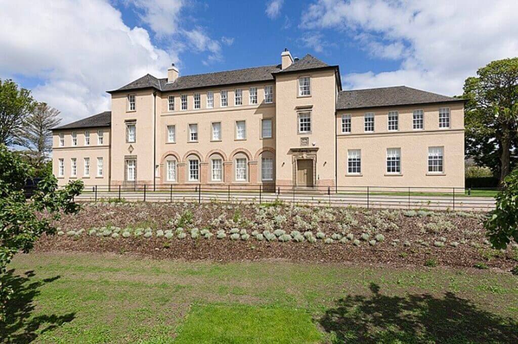 Old-fashioned prep school with maintained lawn